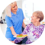 caregiver preparing meal to her patient
