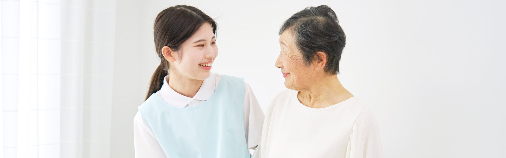 caregiver and her patient smiling